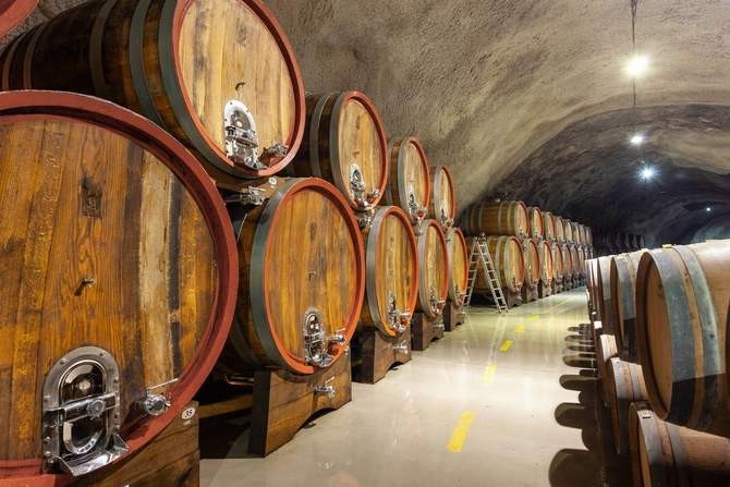 Stainless steel manways with spout in wooden barrels